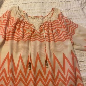 Coral and cream blouse